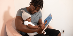 Dad and baby with book