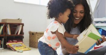 Lady and child reading a book.